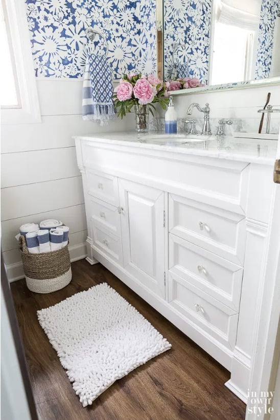 nucore luxury vinyl plank on blue and white bathroom floor